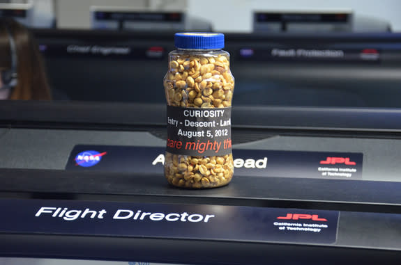 A bottle of peanuts, labeled in part "dare mighty things," is ready and waiting for the landing of NASA's Curiosity rover on Mars on Aug. 5, 2012. The peanuts are part of a long-standing tradition at the Jet Propulsion Laboratory in Pasadena, C