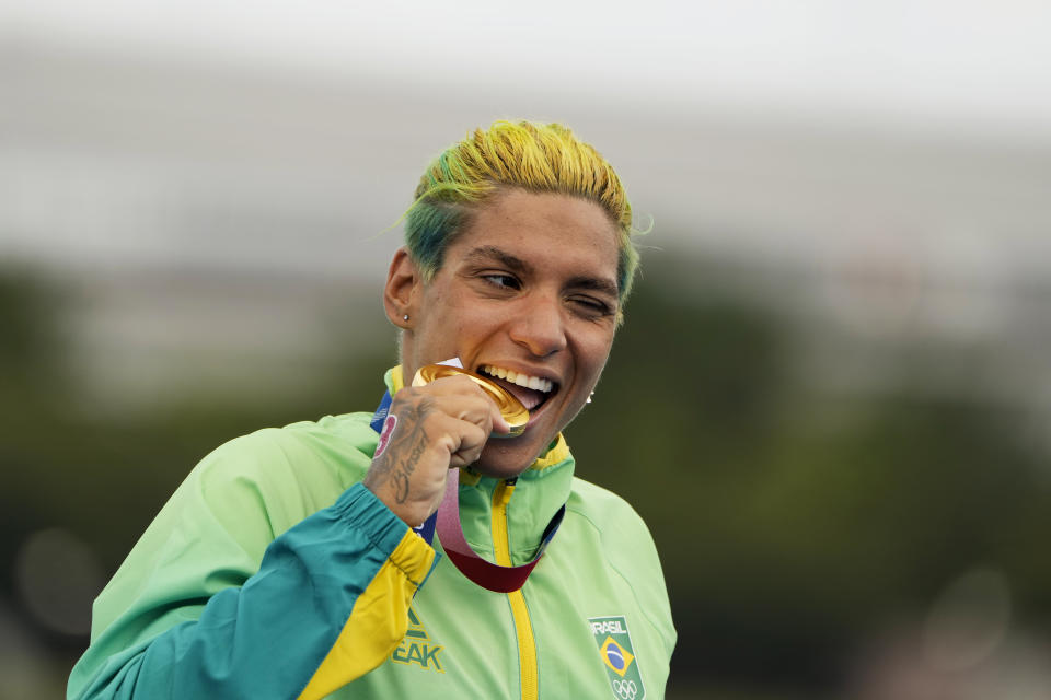 Ana Marcela Cunha, of Brazil, poses with her gold medal after winning the women's marathon swimming event at the 2020 Summer Olympics, Wednesday, Aug. 4, 2021, in Tokyo. (AP Photo/David Goldman)