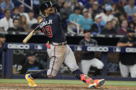Atlanta Braves' Ronald Acuna Jr. (13) hits a sacrifice hit to bring in a run during the eighth inning of a baseball game against the Miami Marlins, Tuesday, May 2, 2023, in Miami. The Braves defeated the Marlins 6-0.(AP Photo/Marta Lavandier)