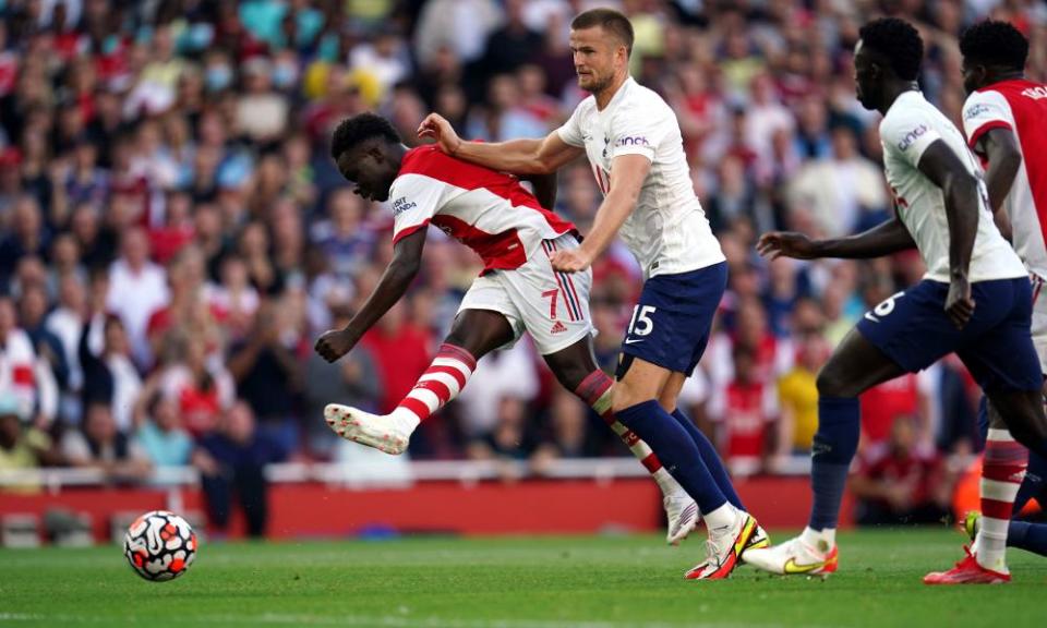 Arsenal’s Bukayo Saka holds off Eric Dier to scores the third goal against Tottenham at the Emirates Stadium.