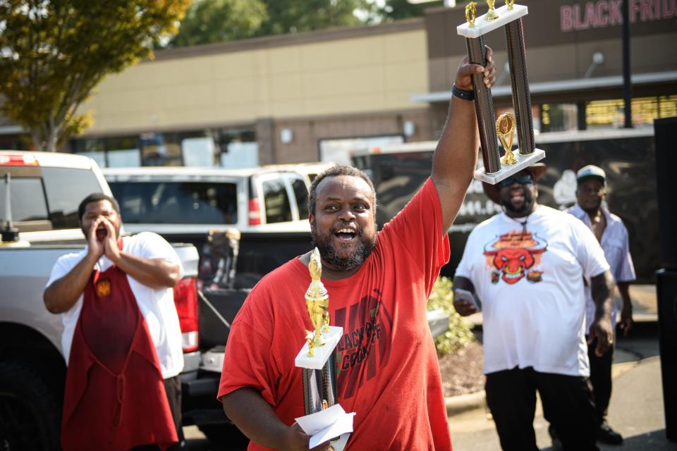 William Wright, of SLFATBOYZBBQ, celebrates after being named the Reserve Grand Champion at the 2nd annual Black BBQ Cook Off on Saturday, Aug. 19, 2023, at Murchison Marketplace.