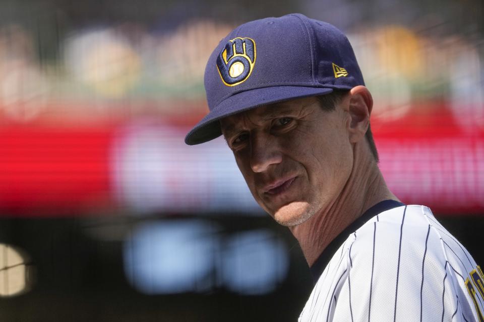 Milwaukee Brewers manager Craig Counsell looks back as Eduardo Escobar leaves the game with an injury during the sixth inning of a baseball game against the Washington Nationals Sunday, Aug. 22, 2021, in Milwaukee. (AP Photo/Morry Gash)