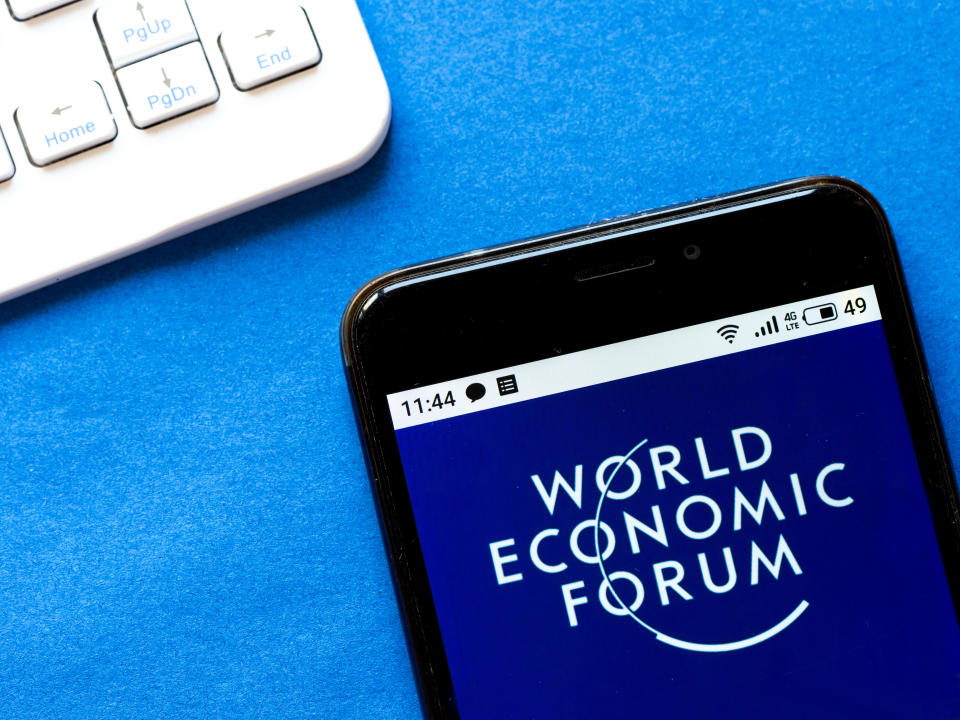 In this photo illustration a World Economic Forum logo seen displayed on a smartphone.