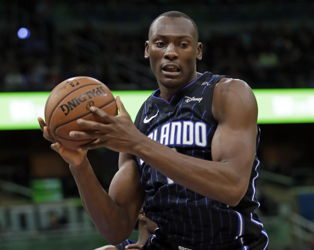 Bismack Biyombo is reportedly headed back to Charlotte in a three-team trade involving the Chicago Bulls and Orlando Magic. (AP)