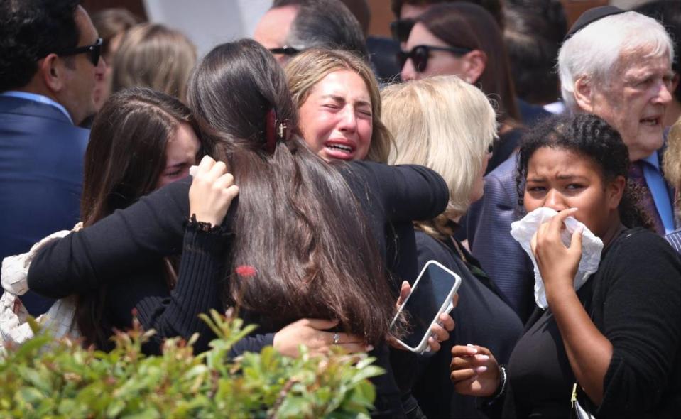 Friends for the Ransom Everglades student, 15-year-old Ella Riley Adler, mourn and support each other outside Temple Beth Sholom shortly after the funeral service on Monday, May 13, 2024, in Miami Beach, Florida.