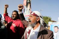 Houthi supporters rally against the United States' designation of Houthis as a foreign terrorist organisation, in Sanaa,