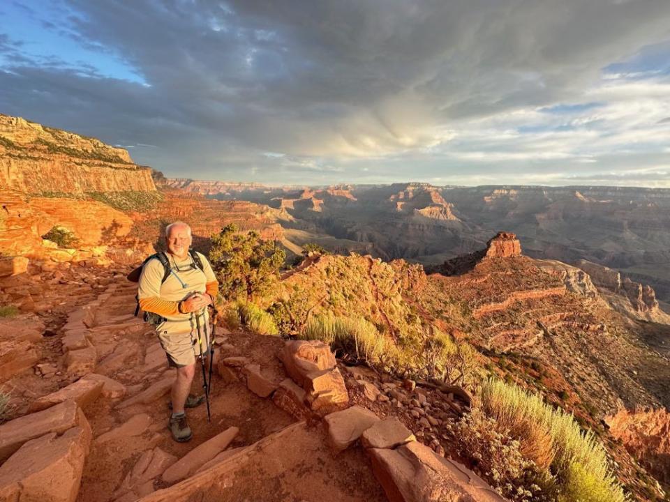 Jimmy Hill hikes along canyon.