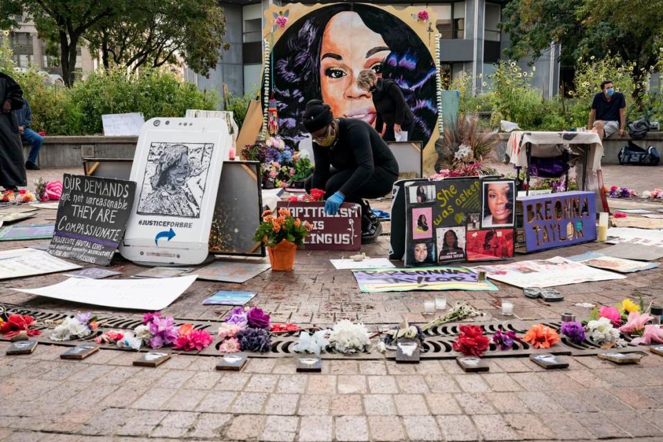 Volunteers maintain a memorial to Breonna Taylor in Louisville, Ky., on Thursday, Sept. 24, 2020, a day after the grand jury indictment of one former police officer on charges of wanton endangerment in the police shooting death of Taylor in March. No officer was charged with killing Taylor.