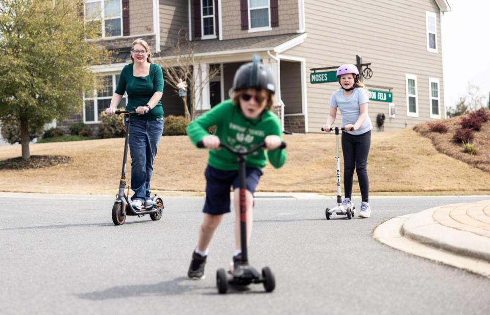 Mary Eggert rides a gift she received from her family this past Christmas — an electric scooter that allows her to keep up with Griffin and Aurora without overexerting herself. “I can stand on it,” she says, “and push the button like a champ.”