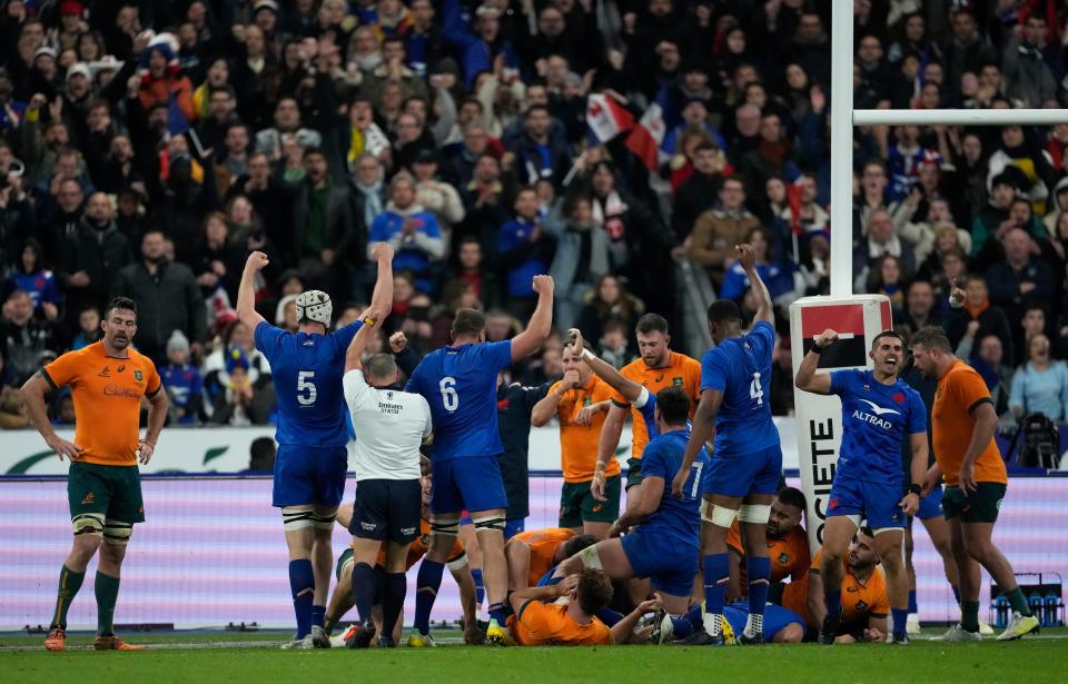 French players celebrate after scoring their first try (AP)