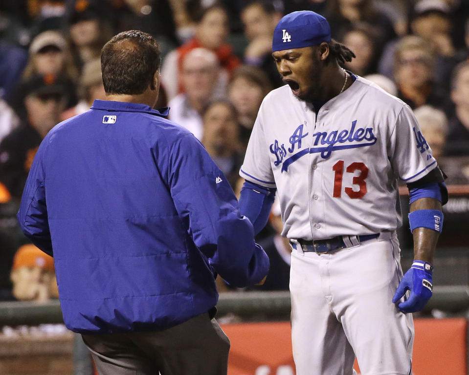 Los Angeles Dodgers' Hanley Ramirez reacts after being hit by a throw from San Francisco Giants' Ryan Vogelsong during the seventh inning of a baseball game on Wednesday, April 16, 2014, in San Francisco. (AP Photo/Marcio Jose Sanchez)