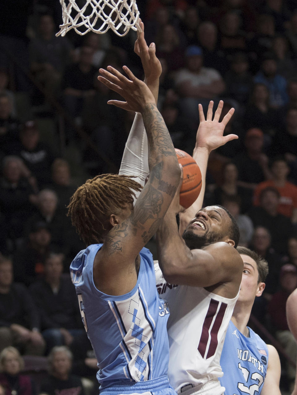 Virginia Tech shooter P.J. Horne gets double teamed by North Carolina during the secondhalf of an NCAA college basketball game in Blacksburg, Va., Wednesday, Jan. 22, 2020.(AP Photo/Lee Luther Jr.)