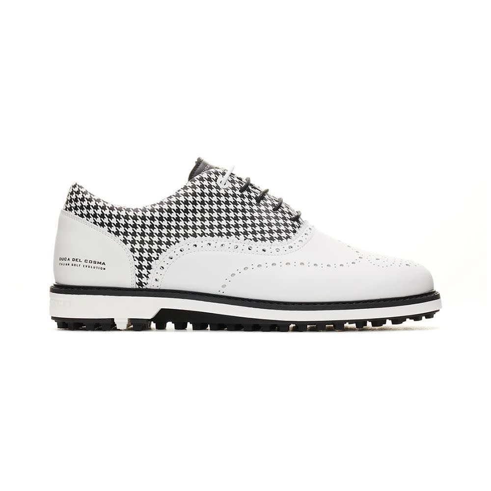 <p><a href="https://ducadelcosma.us/collections/mens-golf-shoes/products/dandy-white-mens-golf-shoes?irclickid=2-t3PZyLUxyLTFNwUx0Mo389UkAQWYWpT33PTM0&irgwc=1" rel="nofollow noopener" target="_blank" data-ylk="slk:Shop Now;elm:context_link;itc:0;sec:content-canvas" class="link rapid-noclick-resp">Shop Now</a></p><p>Dandy White Golf Shoes</p><p>$249.00</p><p>ducadelcosma.us</p>