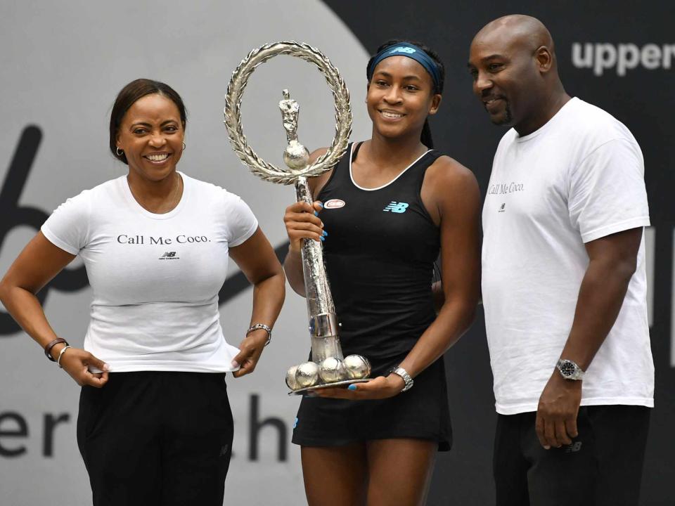 <p>BARBARA GINDL/APA/AFP/Getty</p> Coco Gauff with her parents Corey and Candi Gauff, at the WTA-Upper Austria Ladies final tennis match in 2019