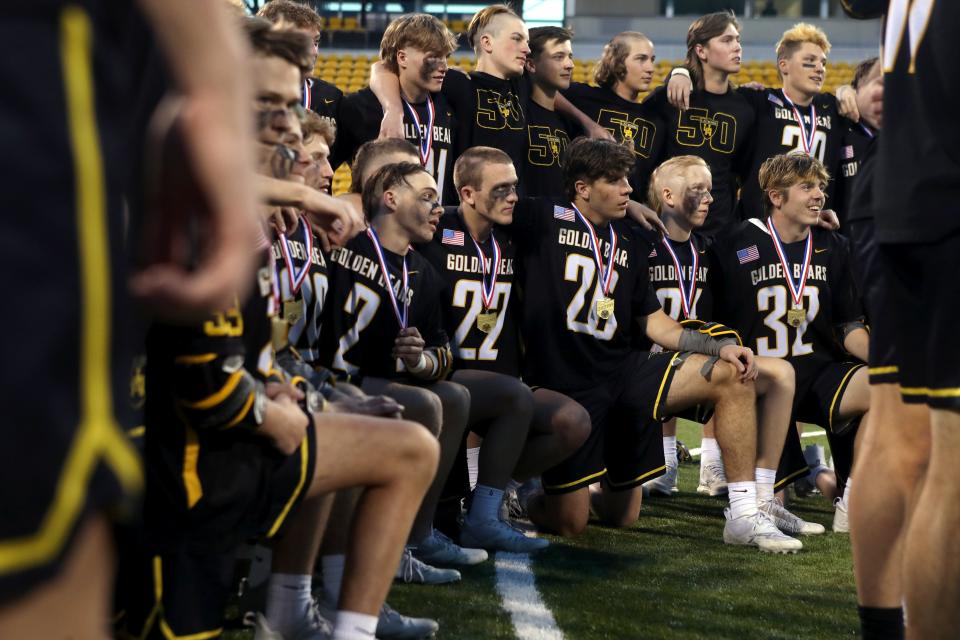 Upper Arlington boys lacrosse players await to receive their championship trophy after a 12-10 win over Dublin Jerome on June 4.