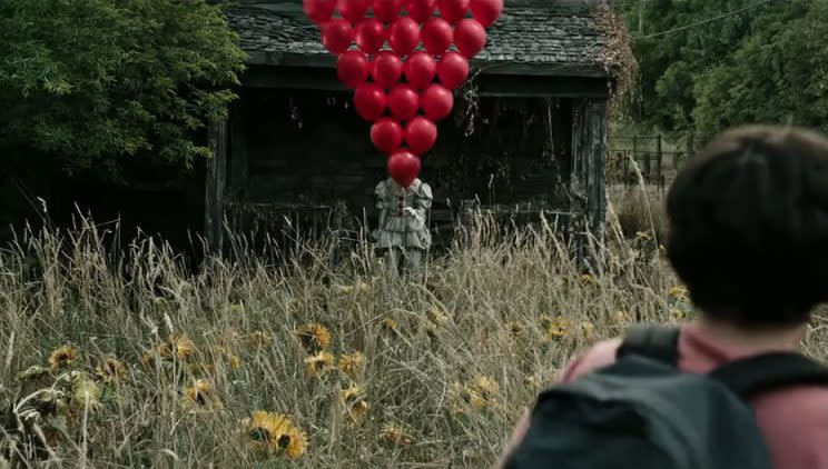 Pennywise... killer clown returns in new clip for remake of Stephen King's It - Credit: Warner Bros