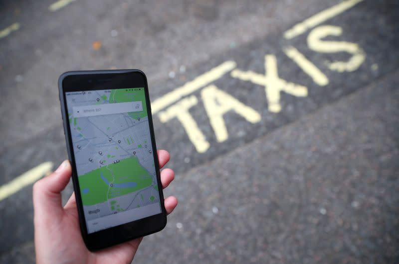 FILE PHOTO: The Uber application is seen on a mobile phone in London