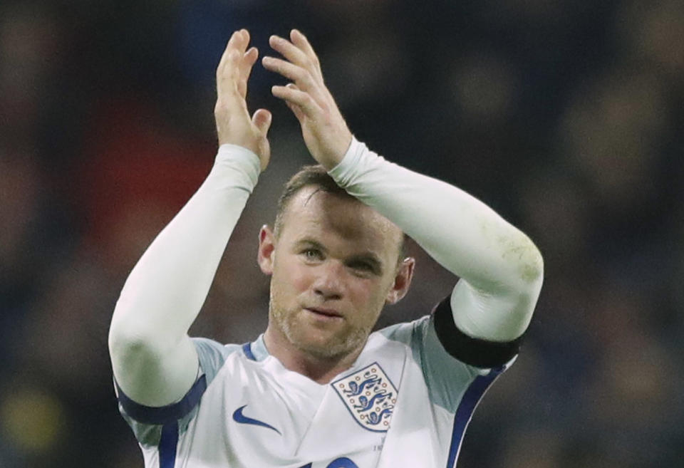 England’s Wayne Rooney as he claps after winning the World Cup group F qualifying soccer match between England and Scotland with a 3-0 score at the Wembley stadium, London. England striker Wayne Rooney announced his immediate retirement from international football on Wednesday Aug. 23, 2017.