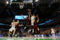 <p>Donte Ingram #0 of the Loyola Ramblers and Admiral Schofield #5 of the Tennessee Volunteers battle for a rebound in the second half during the second round of the 2018 NCAA Tournament at the American Airlines Center on March 17, 2018 in Dallas, Texas. (Photo by Tom Pennington/Getty Images) </p>