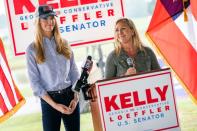 FILE PHOTO: U.S. Senator Kelly Loeffler and Marjorie Taylor Greene speak at a news conference in Dallas