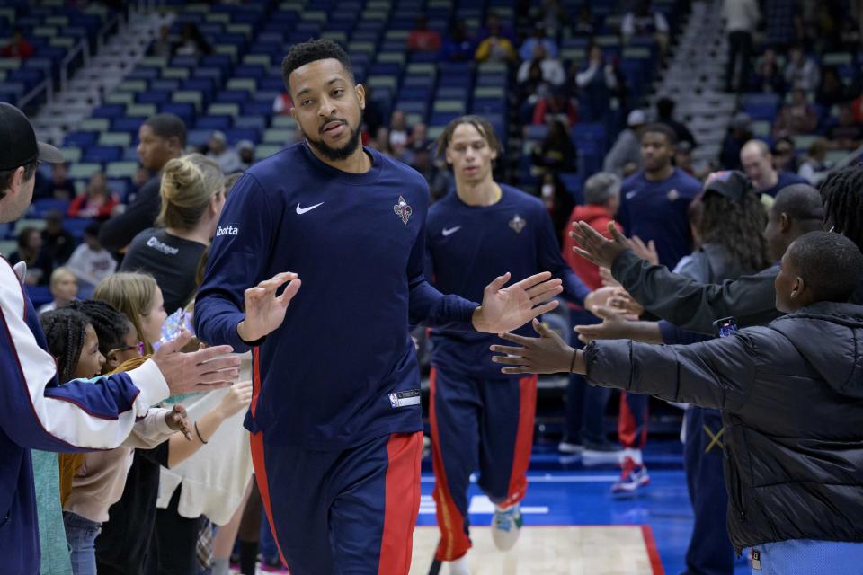 New Orleans Pelicans guard CJ McCollum (3) enters the court before an NBA basketball game against the Detroit Pistons in New Orleans, Thursday, Nov. 2, 2023. (AP Photo/Matthew Hinton)