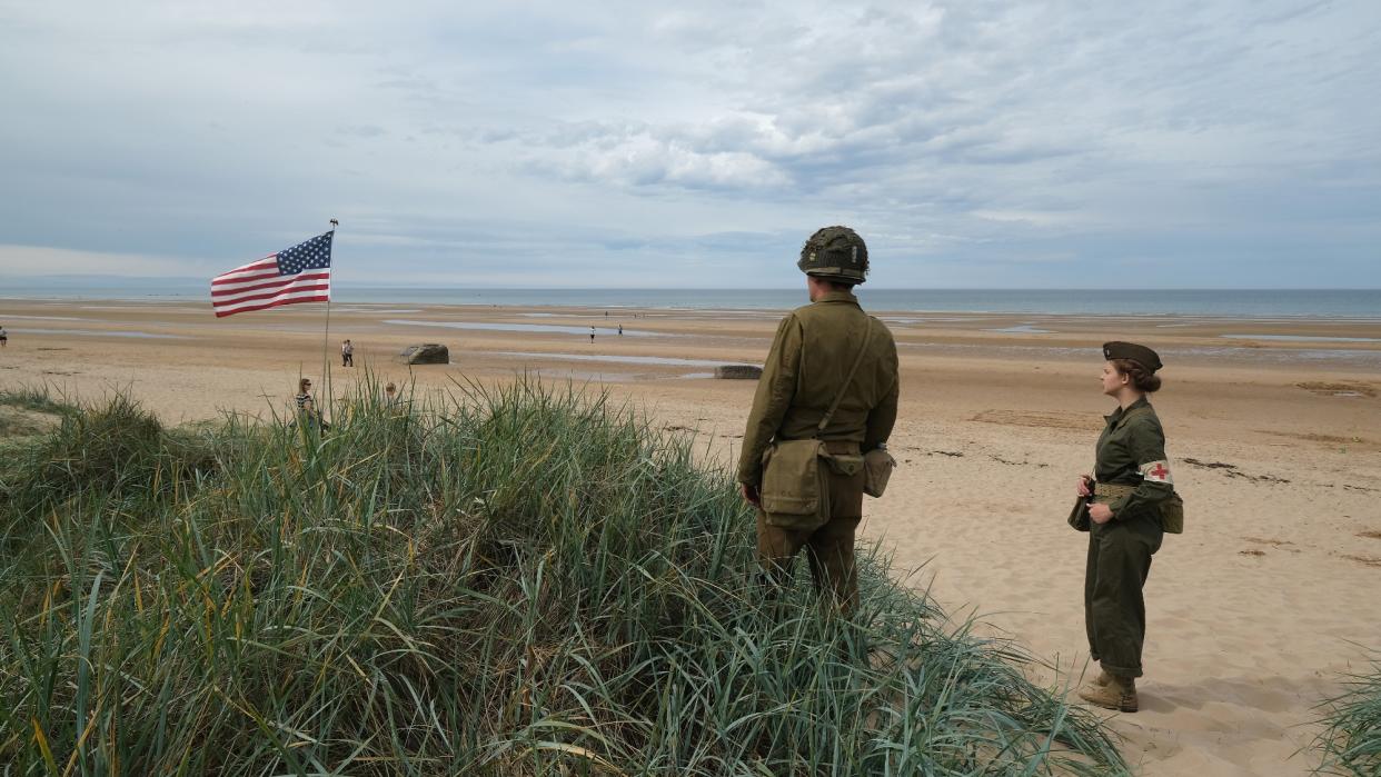  Two World War Two re-enactors at Omaha Beach in Normandy ahead of the 75th anniversary of D-Day in 2019. 