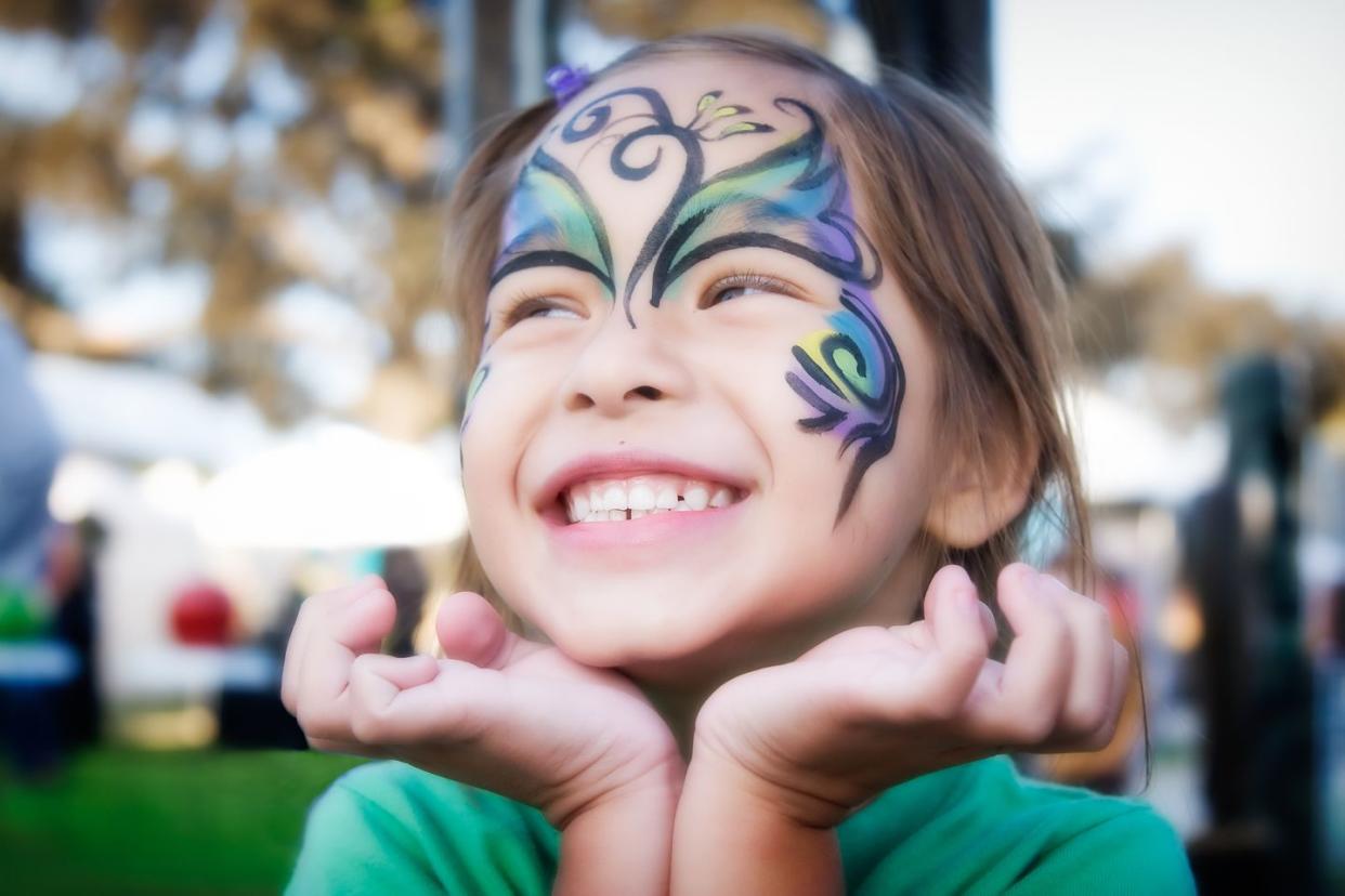 girl smiling with face paint