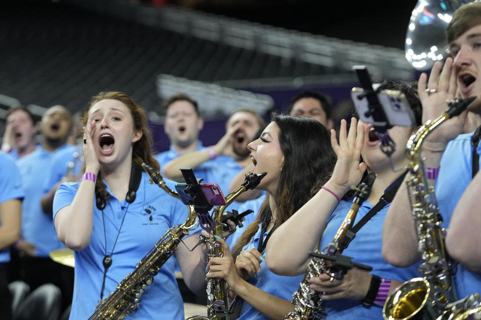 The North Carolina band cheers during practice for the men's Final Four NCAA college basketball tournament, Friday, April 1, 2022, in New Orleans. (AP Photo/Gerald Herbert)