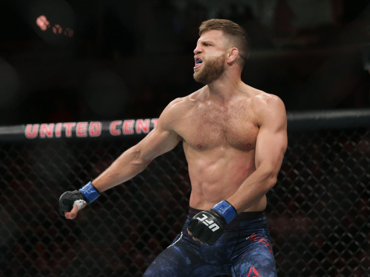 Jun 8, 2019; Chicago, IL, USA;  Calvin Kattar (blue gloves) defeats Ricardo Lamas (red gloves) during UFC 238 at United Center. Mandatory Credit: Jerry Lai-USA TODAY Sports