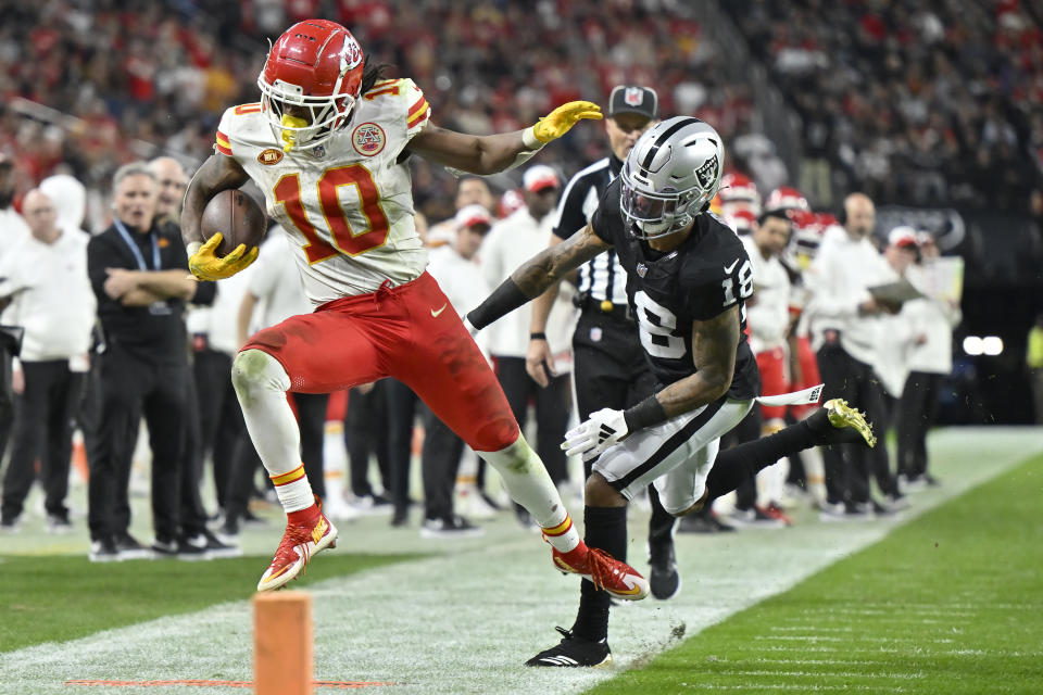 Kansas City Chiefs running back Isiah Pacheco (10) is pushed out of bounds by Las Vegas Raiders cornerback Jack Jones (18) during the second half of an NFL football game, Sunday, Nov. 26, 2023, in Las Vegas. (AP Photo/David Becker)