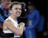 Romania's Simona Halep celebrates after defeating United States' Sofia Kenin in their second round match at the Australian Open tennis championships in Melbourne, Australia, Thursday, Jan. 17, 2019. (AP Photo/Aaron Favila)