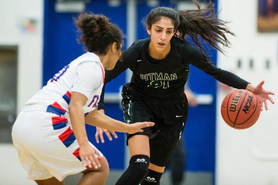 Pitman junior Kaylin Randhawa (21) dribbles up the court during a game against Atwater at Atwater High School in Atwater, Calif., on Tuesday, Jan. 24, 2017. The Pride beat the Falcons 45-43.