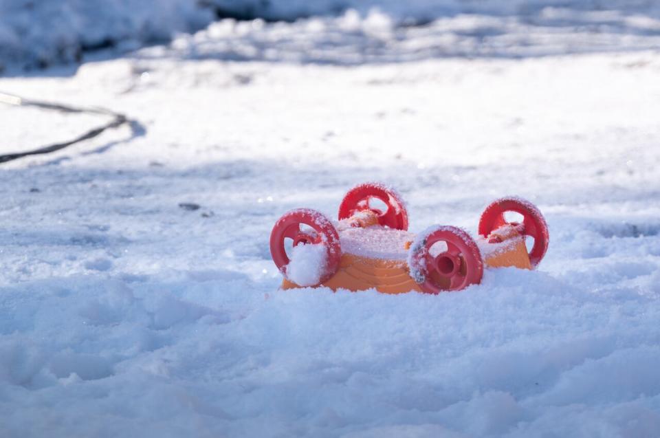 A toy lies on the ground of the scene of a house fire that happened Sunday on Ottawa Street in Davidson, Sask., Monday, Feb. 19, 2024. 