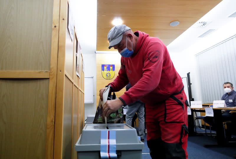 A person casts his ballot during the parliamentary elections in Lovosice