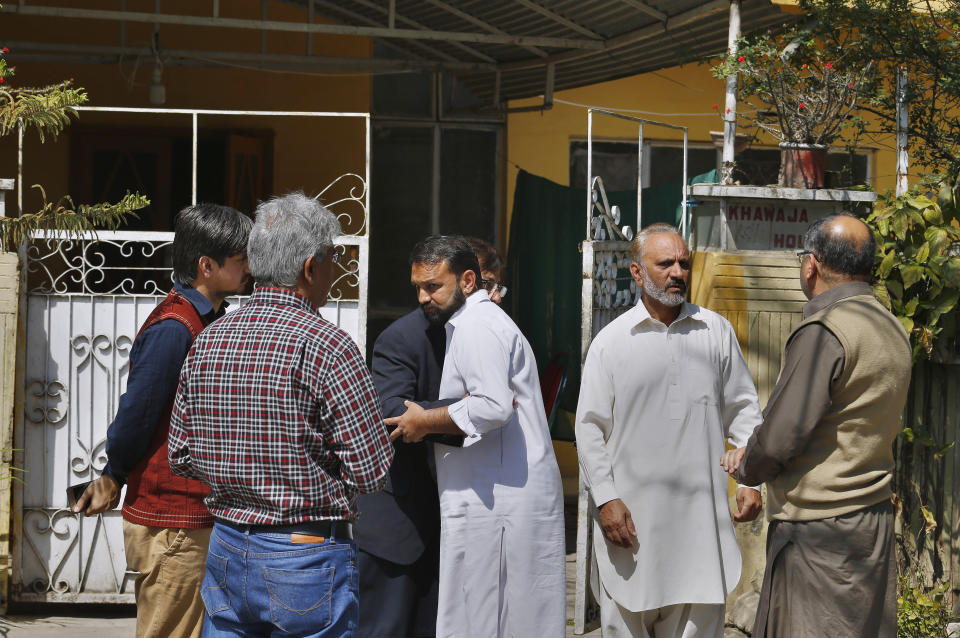 Relatives arrive for condolence at the family home of Haroon Mahmood, a Pakistani citizen who was killed in Christchurch mosque shootings, in Islamabad, Pakistan, Sunday, March 17, 2019. Pakistan's foreign ministry spokesman says three more Pakistanis have been identified among the dead increasing the number of Pakistanis to nine killed in the mass shootings at two mosques in the New Zealand city of Christchurch. (AP Photo/Anjum Naveed)