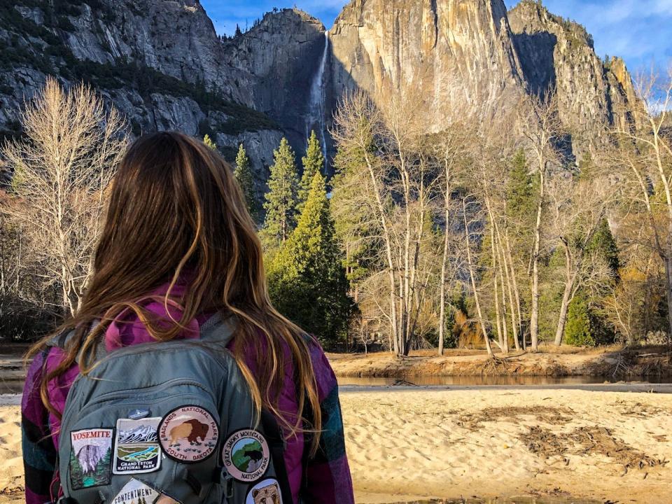 Emily faces a rocky landscape at Yosemite National Park.