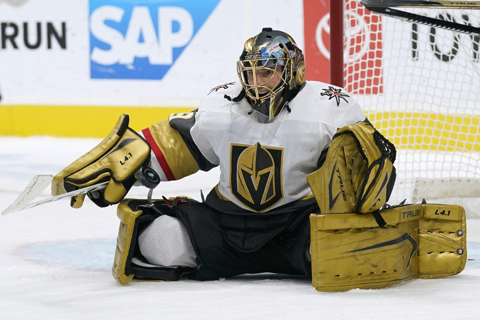 Vegas Golden Knights goaltender Marc-Andre Fleury defends on a shot by the San Jose Sharks during the first period of an NHL hockey game in San Jose, Calif., Saturday, March 6, 2021. (AP Photo/Jeff Chiu)