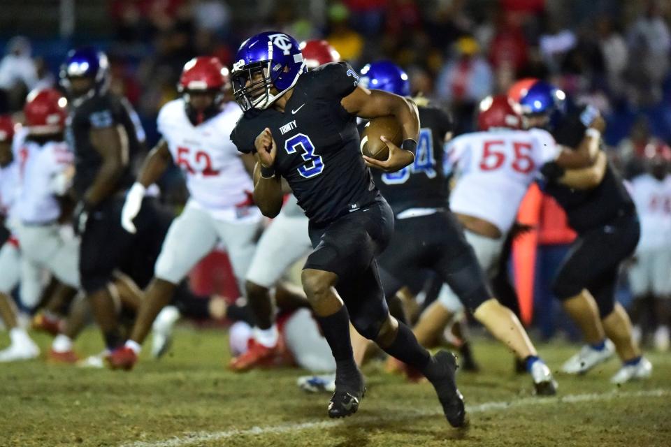 Trinity Christian's Treyaun Webb (3) finds a lane during the first quarter Friday, Nov. 26, 2021 at Trinity Christian Academy in Jacksonville. Trinity Christian and Quincy Munroe faced off during an FHSAA 2A Region 1 Championship. Trinity defeated Munroe 39-22 and advance to the final four. 