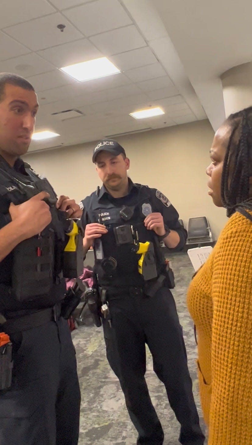 Shelley Morrison speaks to airport police officers the night of Dec. 25, 2022, at the Nashville International Airport.