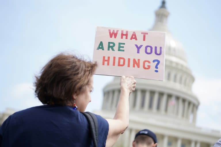 Protestors take part in the "Tax March" to call on US President Donald Trump to release his tax records on April 15, 2017 in Washington, DC