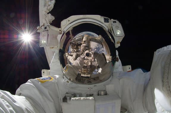 Japanese astronaut Aki Hoshide get's incredible selfie with the earth and the sun