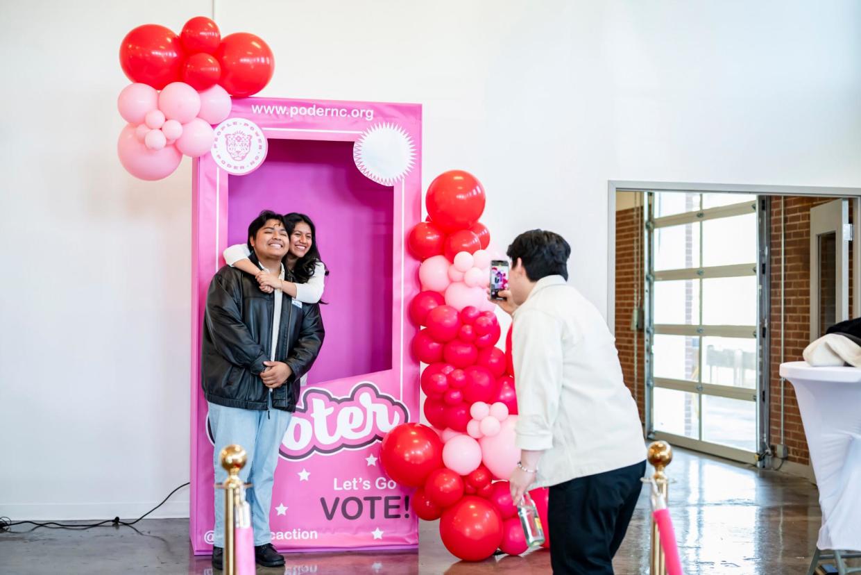 <span>Voters attend a Ballots y Beleza event where they receive free beauty services and a sample ballot.</span><span>Photograph: Poder NC Action</span>