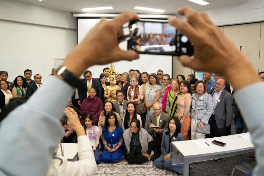 Supporters of a Cambodian pro-democracy movement pose for a photo at their inaugural event.