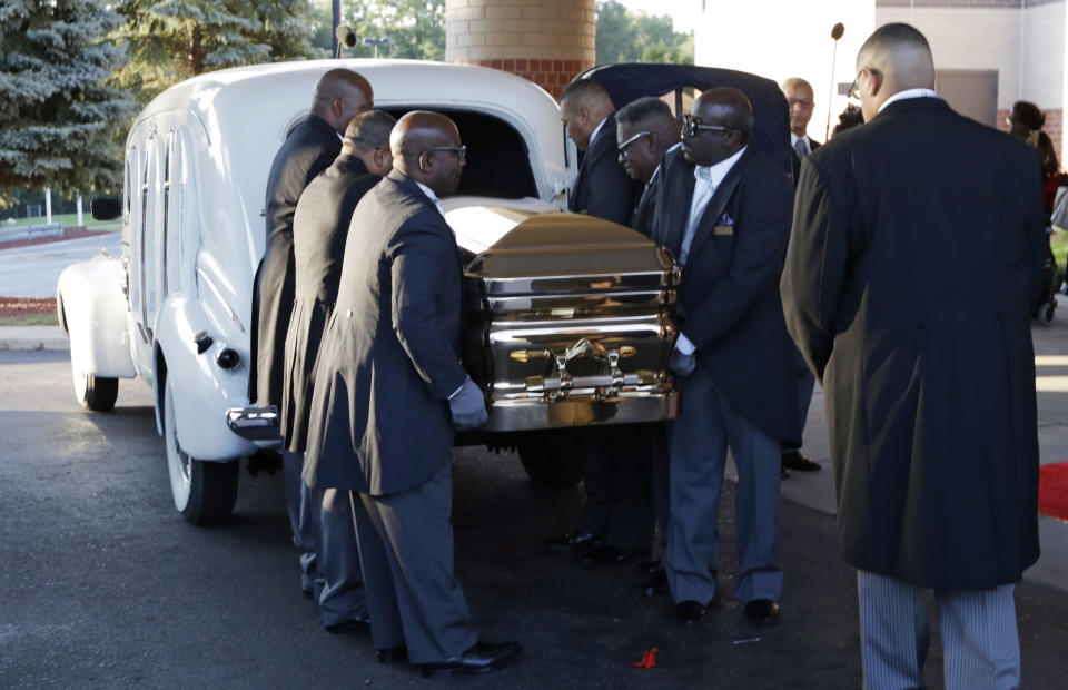 Pallbearers carry the gold casket of legendary singer Aretha Franklin after arriving at the Greater Grace Temple in Detroit, Friday, Aug. 31, 2018. Franklin died Aug. 16 of pancreatic cancer at the age of 76. (AP Photo/Tony Dejak)