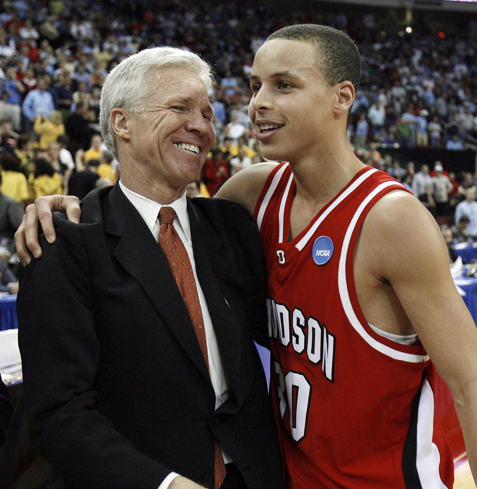 Davidson head coach Bob McKillop, left, and Stephen Curry celebrate during the 2008 men's NCAA tournament. (Chris Seward/Raleigh News & Observer/Tribune News Service via Getty Images)