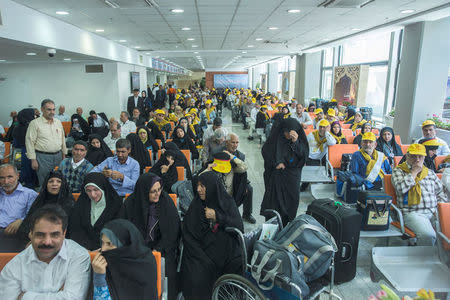 Iranian pilgrims wait at the Imam Khomeini airport in Tehran as they depart for the annual haj pilgrimage to the holy city of Mecca, in Tehran, Iran, July 31, 2017. Nazanin Tabatabaee Yazdi / TIMA via REUTERS.