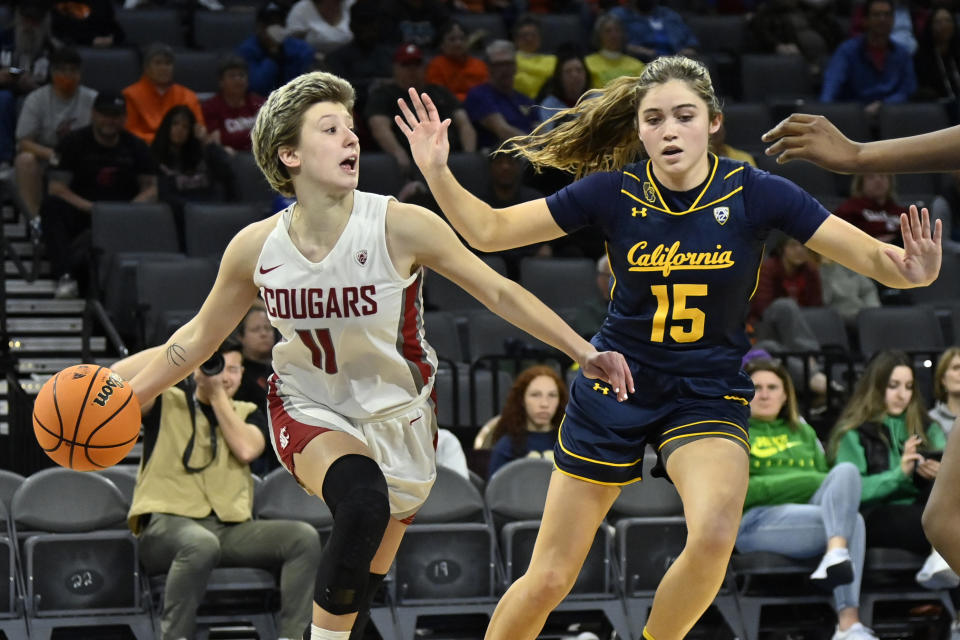 Washington State guard Astera Tuhina (11) looks to pass against California guard Kemery Martin (15) during the second half of an NCAA college basketball game in the first round of the Pac-12 women's tournament Wednesday, March 1, 2023, in Las Vegas. (AP Photo/David Becker)