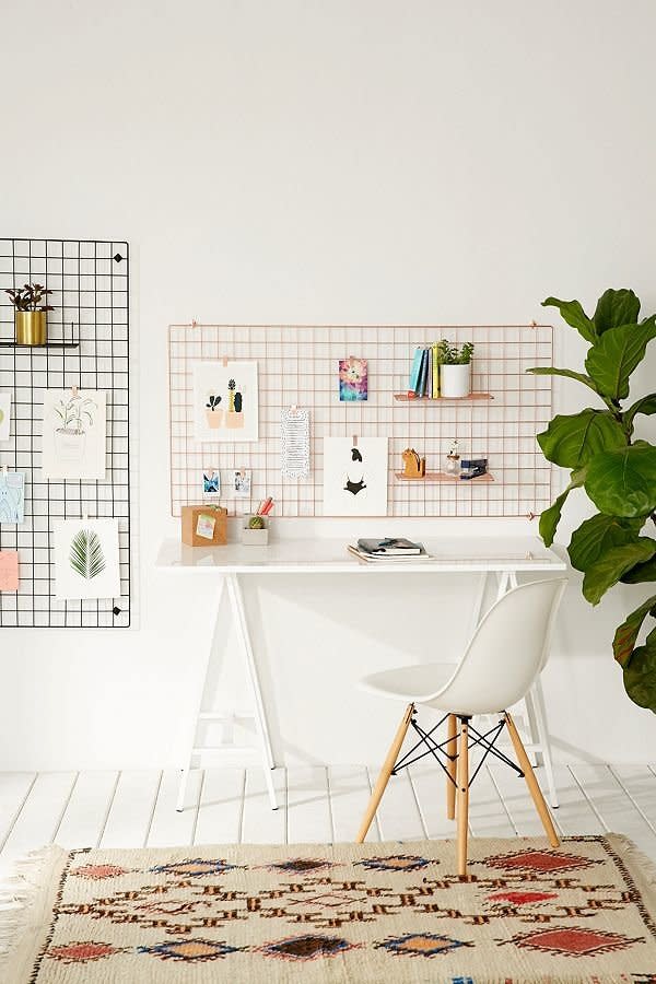 <a href="https://www.urbanoutfitters.com/shop/large-wire-wall-grid?category=dinnerware&amp;color=001" target="_blank">This wall hanging unit</a> can be used in an entryway, above your bed, near your desk, and elsewhere thanks to its multi-purpose design.