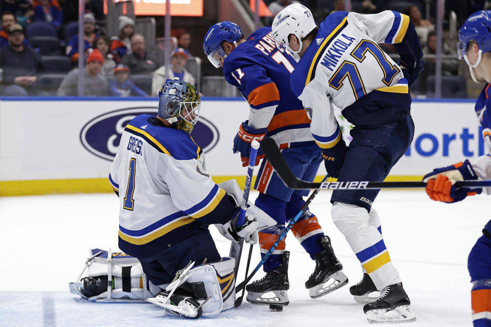 St. Louis Blues goaltender Thomas Greiss makes a save against New York Islanders left wing Zach Parise (11) during the second period of an NHL hockey game Tuesday, Dec. 6, 2022, in Elmont, N.Y. (AP Photo/Adam Hunger)