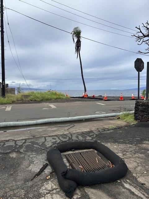 This photo provided by the County of Maui shows a storm ditch and protective barriers in Lahaina, Hawaii, on Wednesday, Nov. 29, 2023. Maui officials were on standby Wednesday, Nov. 29, 2023, to prevent ash from August's deadly wildfire in Lahaina from flowing into storm drains after forecasters said a winter storm could bring heavy rain and strong winds to the island. (Mia A'i/County of Maui via AP)